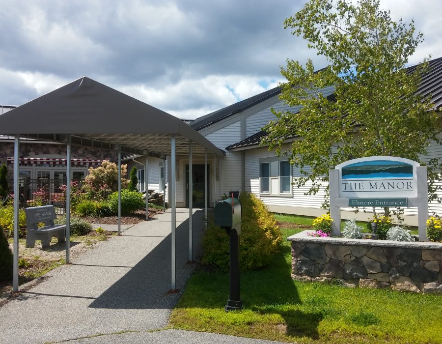 The welcome sign outside of The Manor in Morrisville, Vermont.