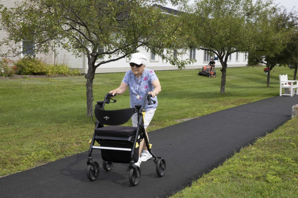 A resident at the Manor getting some outdoor exercise