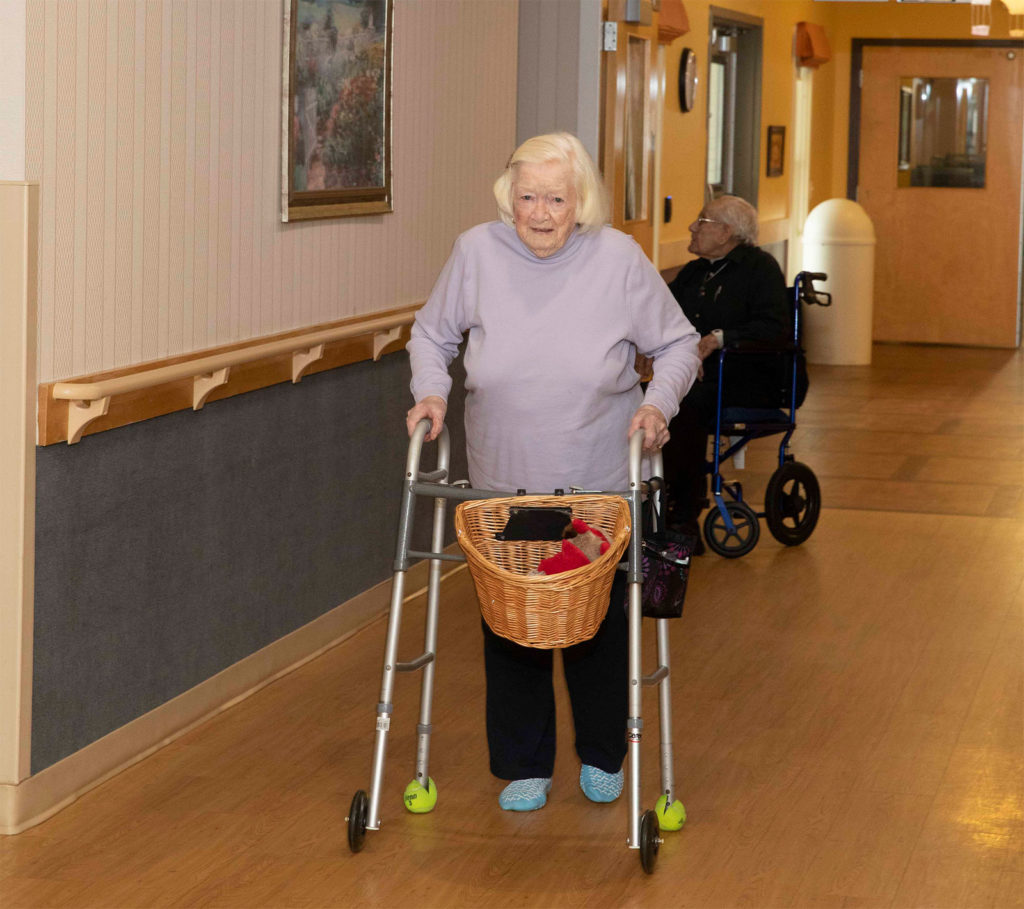 A resident at the Manor with her walker