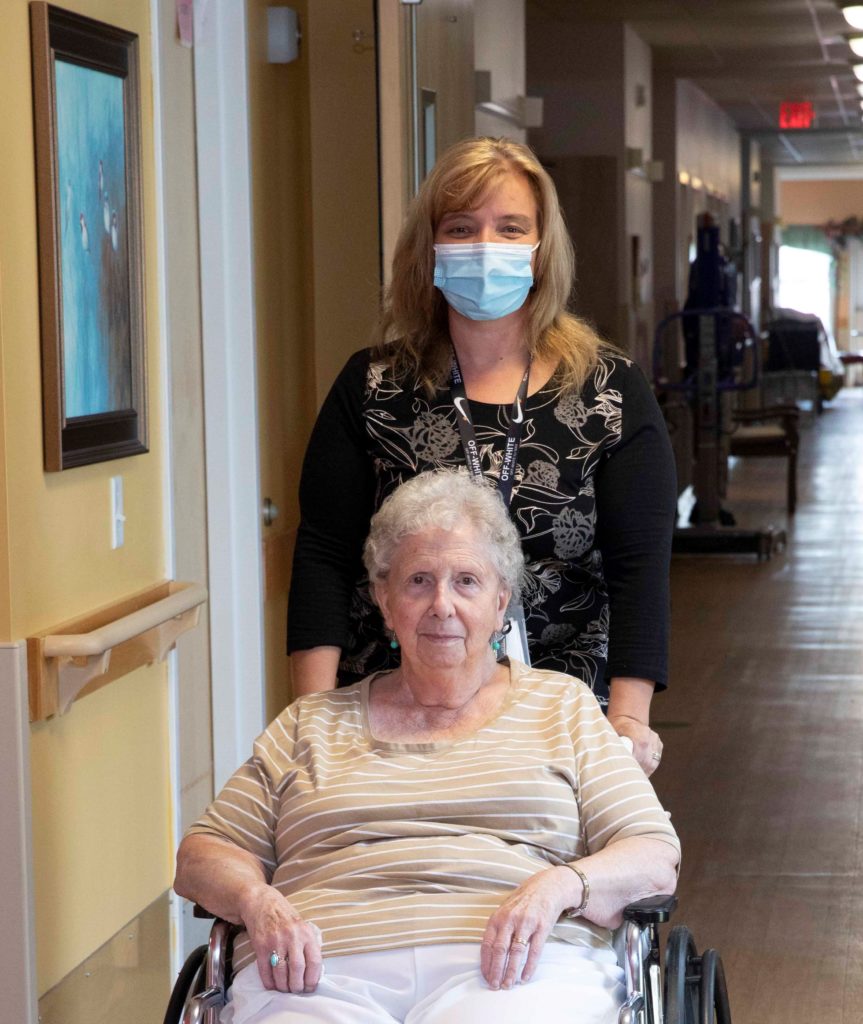 A resident and caregiver at The Manor in Vermont